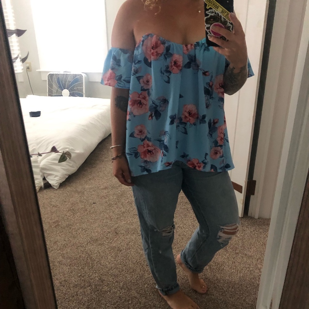 Light blue, flowery off the shoulder blouse.